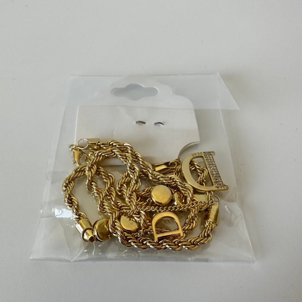 Gold tone necklace with letter D with crystals